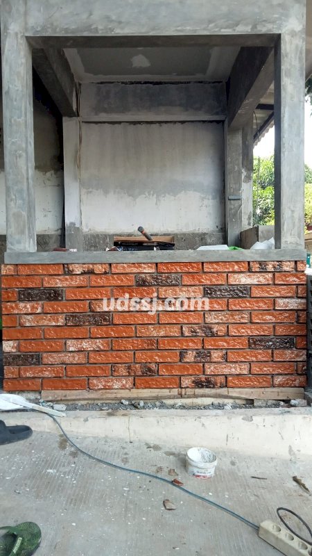 pemasangan bata tempel eksterior dengan coating terakota